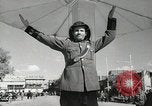 Image of Traffic policeman under umbrella Baghdad Iraq, 1942, second 10 stock footage video 65675022192