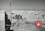 Image of Traffic policeman under umbrella Baghdad Iraq, 1942, second 12 stock footage video 65675022192