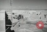 Image of Traffic policeman under umbrella Baghdad Iraq, 1942, second 14 stock footage video 65675022192
