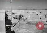 Image of Traffic policeman under umbrella Baghdad Iraq, 1942, second 15 stock footage video 65675022192