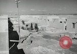 Image of Traffic policeman under umbrella Baghdad Iraq, 1942, second 17 stock footage video 65675022192