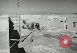 Image of Traffic policeman under umbrella Baghdad Iraq, 1942, second 18 stock footage video 65675022192