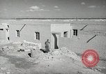 Image of Traffic policeman under umbrella Baghdad Iraq, 1942, second 20 stock footage video 65675022192