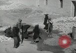 Image of Traffic policeman under umbrella Baghdad Iraq, 1942, second 27 stock footage video 65675022192