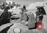 Image of Traffic policeman under umbrella Baghdad Iraq, 1942, second 31 stock footage video 65675022192
