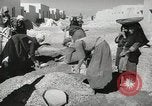 Image of Traffic policeman under umbrella Baghdad Iraq, 1942, second 32 stock footage video 65675022192