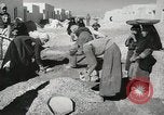 Image of Traffic policeman under umbrella Baghdad Iraq, 1942, second 34 stock footage video 65675022192