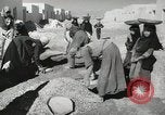 Image of Traffic policeman under umbrella Baghdad Iraq, 1942, second 35 stock footage video 65675022192