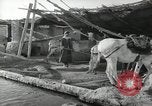 Image of Traffic policeman under umbrella Baghdad Iraq, 1942, second 50 stock footage video 65675022192