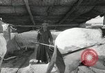 Image of Traffic policeman under umbrella Baghdad Iraq, 1942, second 59 stock footage video 65675022192