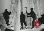 Image of Fishermen de-icing fishing boats Boston Massachusetts USA, 1935, second 18 stock footage video 65675022201