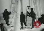 Image of Fishermen de-icing fishing boats Boston Massachusetts USA, 1935, second 19 stock footage video 65675022201