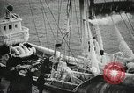 Image of Fishermen de-icing fishing boats Boston Massachusetts USA, 1935, second 31 stock footage video 65675022201