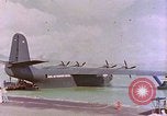 Image of US Aircraft JRM-1 removing casualties and taking off Pearl Harbor Hawaii USA, 1946, second 61 stock footage video 65675022271