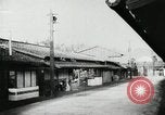 Image of Japanese citizens listen to radio Japan, 1941, second 15 stock footage video 65675022280