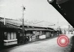 Image of Japanese citizens listen to radio Japan, 1941, second 24 stock footage video 65675022280