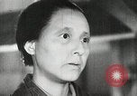 Image of Japanese citizens listen to radio Japan, 1941, second 33 stock footage video 65675022280