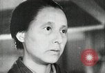 Image of Japanese citizens listen to radio Japan, 1941, second 34 stock footage video 65675022280