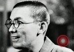 Image of Japanese citizens listen to radio Japan, 1941, second 36 stock footage video 65675022280