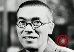 Image of Japanese citizens listen to radio Japan, 1941, second 39 stock footage video 65675022280