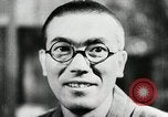 Image of Japanese citizens listen to radio Japan, 1941, second 40 stock footage video 65675022280