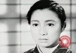 Image of Japanese citizens listen to radio Japan, 1941, second 42 stock footage video 65675022280