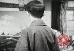 Image of Japanese citizens listen to radio Japan, 1941, second 47 stock footage video 65675022280