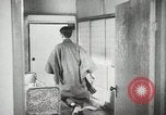 Image of Japanese citizens listen to radio Japan, 1941, second 54 stock footage video 65675022280