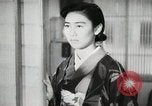 Image of Japanese citizens listen to radio Japan, 1941, second 57 stock footage video 65675022280