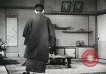 Image of Japanese citizens listen to radio Japan, 1941, second 60 stock footage video 65675022280