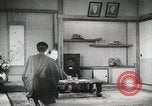 Image of Japanese citizens listen to radio Japan, 1941, second 61 stock footage video 65675022280