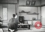 Image of Japanese citizens listen to radio Japan, 1941, second 62 stock footage video 65675022280