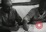Standbild Offiziere auf Japanischen Uboot plot Position und Navigieren Indischer Ozean, 1942, aus Sekunde 60 historischem Filmmaterial Videoclip 65675022283