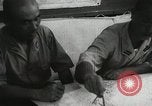 Standbild Offiziere auf Japanischen Uboot plot Position und Navigieren Indischer Ozean, 1942, aus Sekunde 61 historischem Filmmaterial Videoclip 65675022283