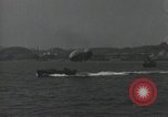 Standbild Schnellboot schleppt Prallluftschiffe Yokosuka Yokosuka Japan Hafen, 1940, aus Sekunde 4 historischem Filmmaterial Videoclip 65675022297