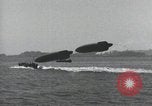 Standbild Schnellboot schleppt Prallluftschiffe Yokosuka Yokosuka Japan Hafen, 1940, aus Sekunde 22 historischem Filmmaterial Videoclip 65675022297