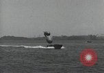 Standbild Schnellboot schleppt Prallluftschiffe Yokosuka Yokosuka Japan Hafen, 1940, aus Sekunde 51 historischem Filmmaterial Videoclip 65675022297