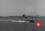 Standbild Schnellboot schleppt Prallluftschiffe Yokosuka Yokosuka Japan Hafen, 1940, aus Sekunde 54 historischem Filmmaterial Videoclip 65675022297