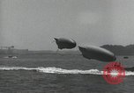 Standbild Schnellboot schleppt Prallluftschiffe Yokosuka Yokosuka Japan Hafen, 1940, aus Sekunde 59 historischem Filmmaterial Videoclip 65675022297