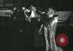 Image of priest performs religious ceremony United States USA, 1934, second 17 stock footage video 65675022430