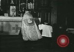 Image of priest performs religious ceremony United States USA, 1934, second 26 stock footage video 65675022430