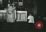 Image of priest performs religious ceremony United States USA, 1934, second 32 stock footage video 65675022430