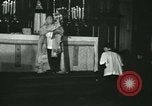 Image of priest performs religious ceremony United States USA, 1934, second 37 stock footage video 65675022430