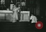 Image of priest performs religious ceremony United States USA, 1934, second 39 stock footage video 65675022430