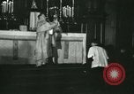 Image of priest performs religious ceremony United States USA, 1934, second 40 stock footage video 65675022430