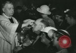 Image of priest performs religious ceremony United States USA, 1934, second 55 stock footage video 65675022430