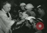Image of priest performs religious ceremony United States USA, 1934, second 57 stock footage video 65675022430