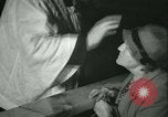 Image of priest performs religious ceremony United States USA, 1934, second 62 stock footage video 65675022430