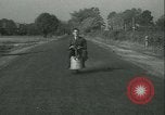 Standbild Motorroller United States USA, 1933, aus Sekunde 27 historischem Filmmaterial Videoclip 65675022493
