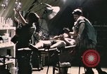 Image of wounded United States soldier Vietnam, 1969, second 8 stock footage video 65675022607